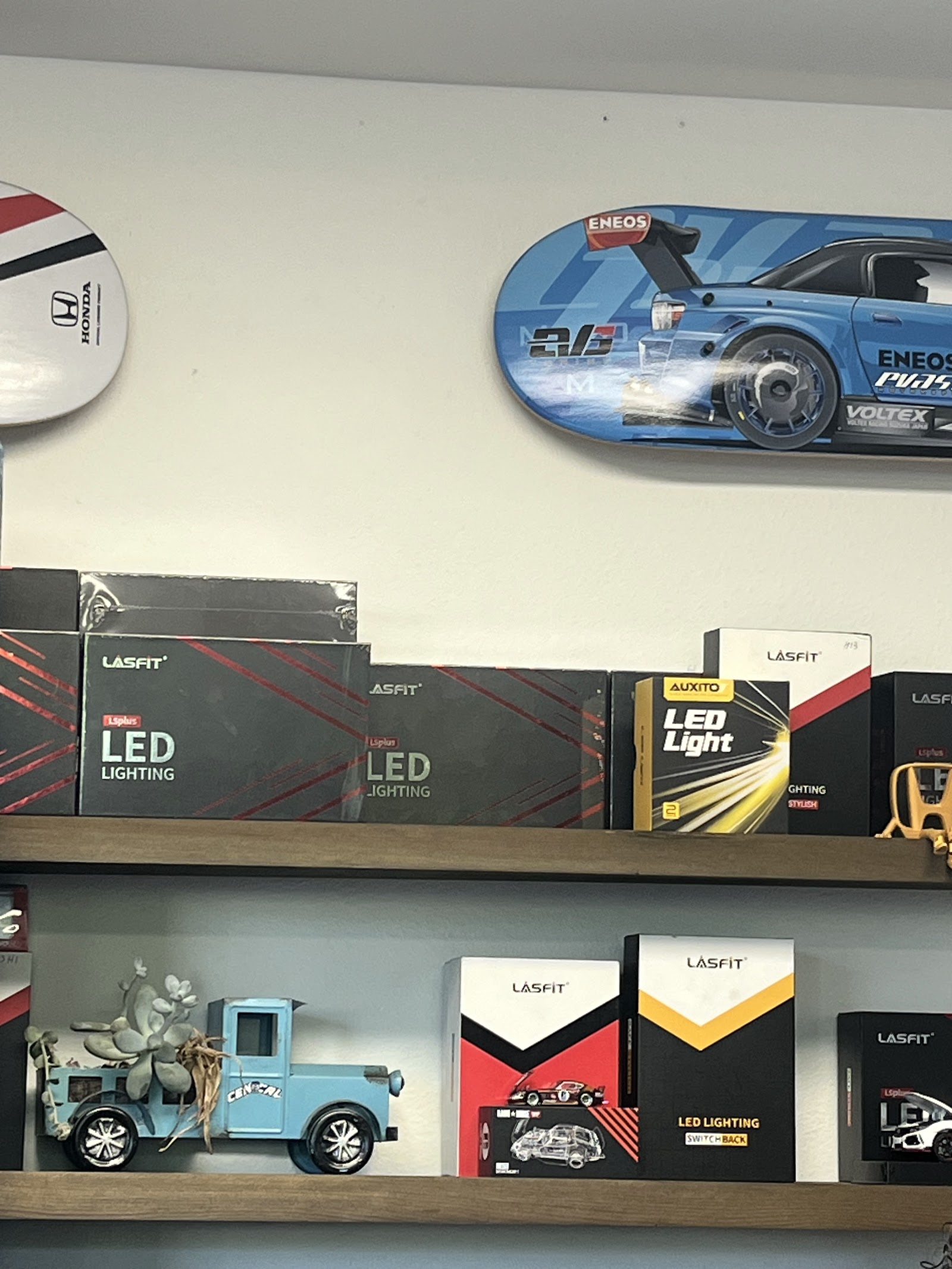 The waiting-room wall — Honda decks and parts stock