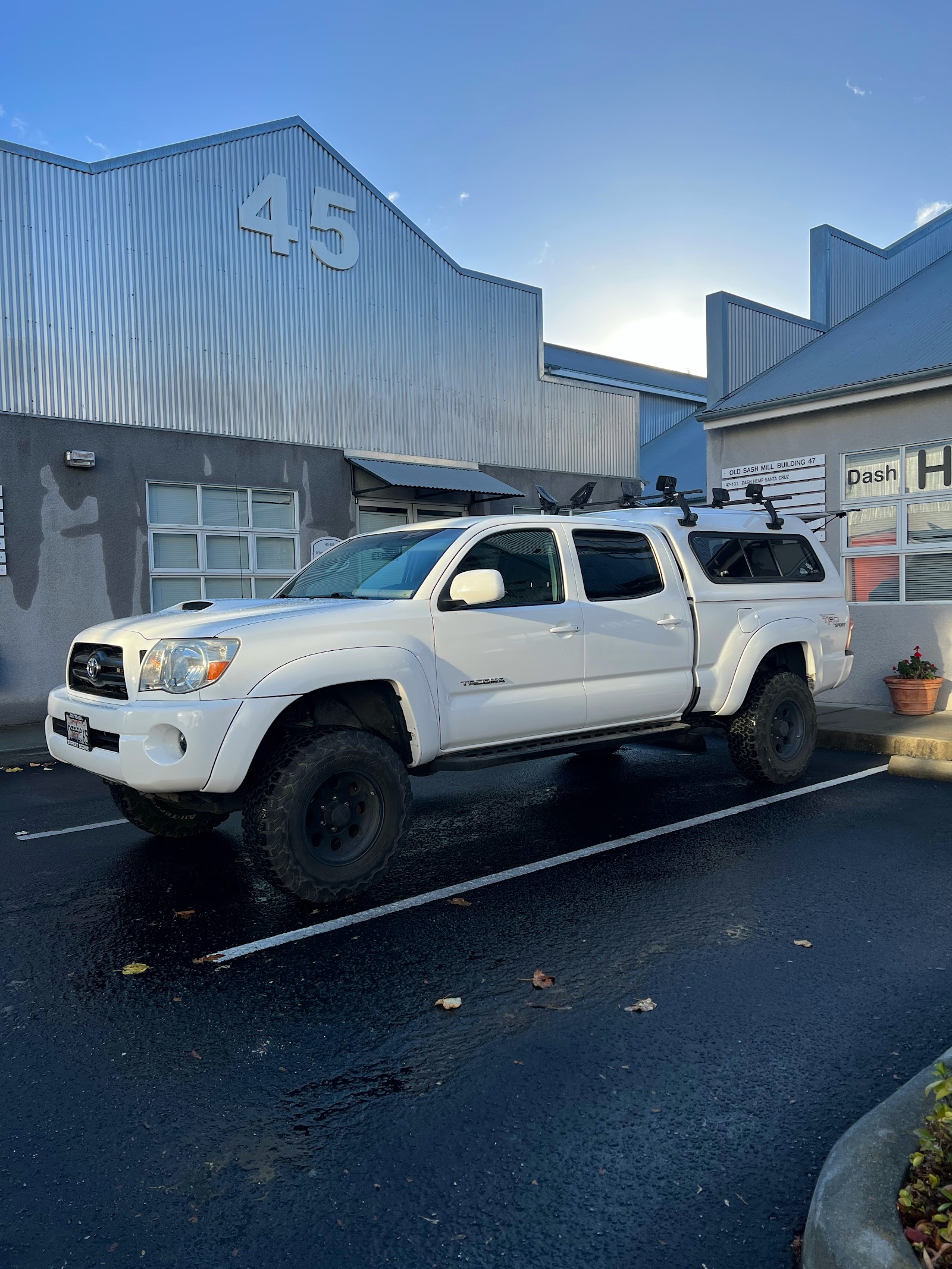 A lifted Toyota Tacoma TRD outside the shop
