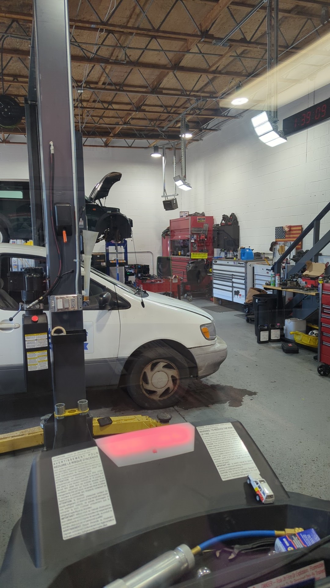 In the bay — gauges hooked up, Toyota on the lift
