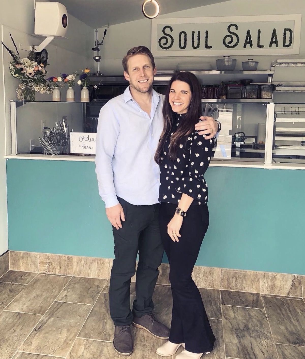 the owners of Soul Salad at the counter