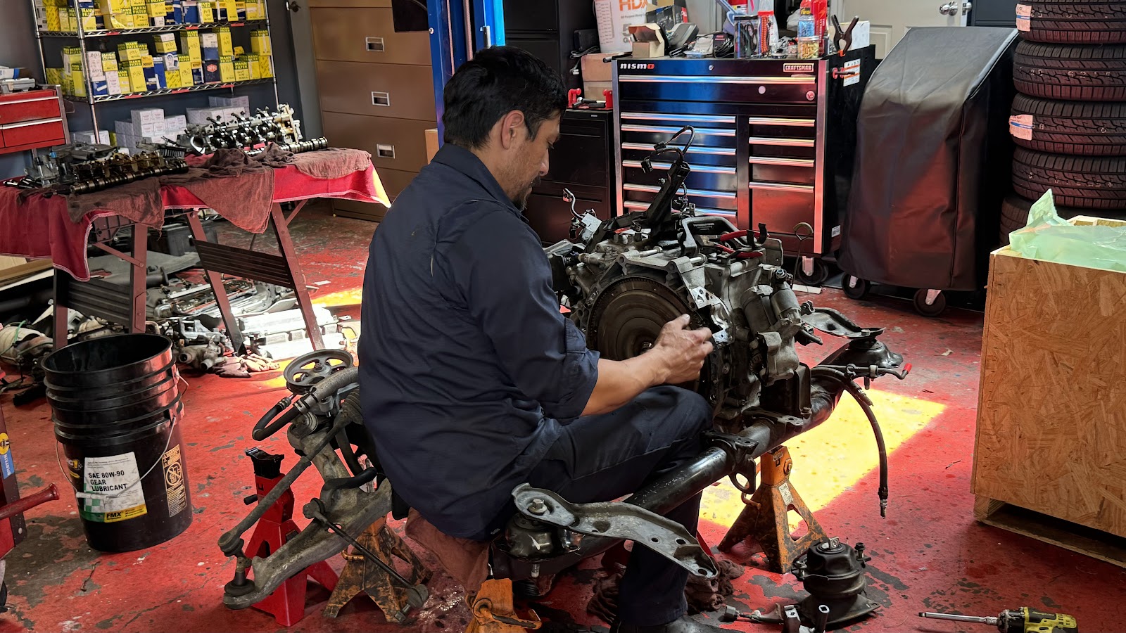 a tech deep in a job on the stand